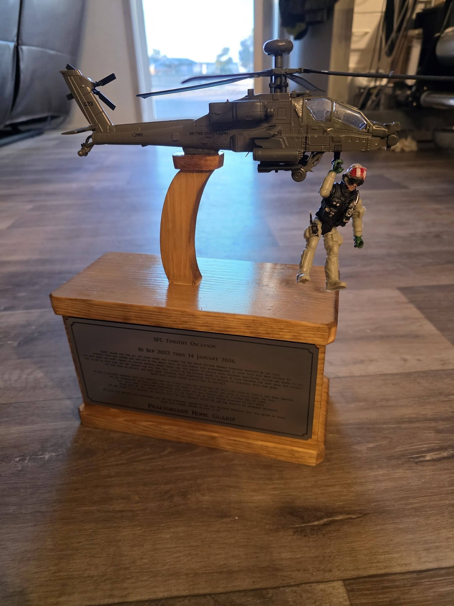 Apache helicopter model on wood base
