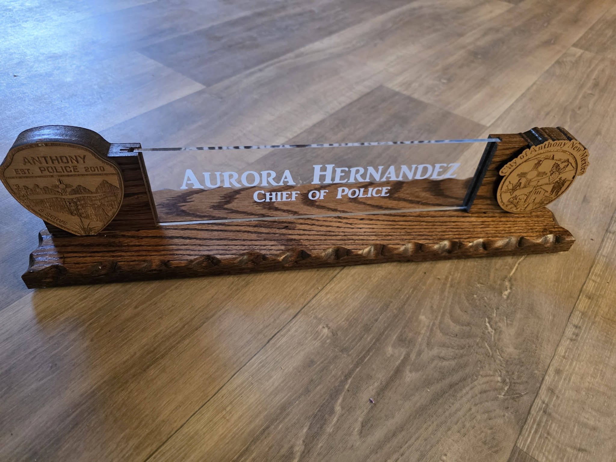 Layered brand logo plaque with farewell plate